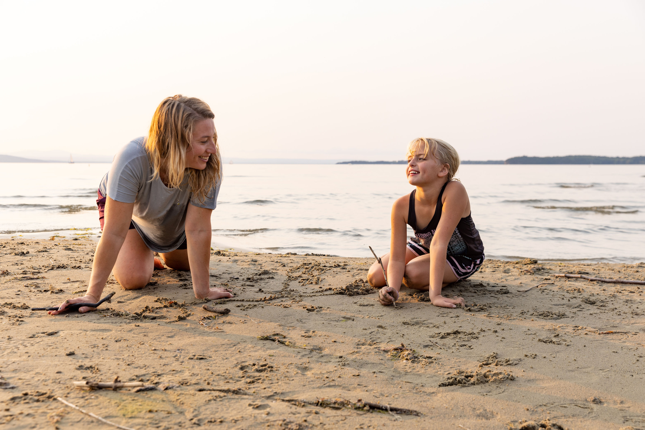 A woman and young girl have fun in the park.